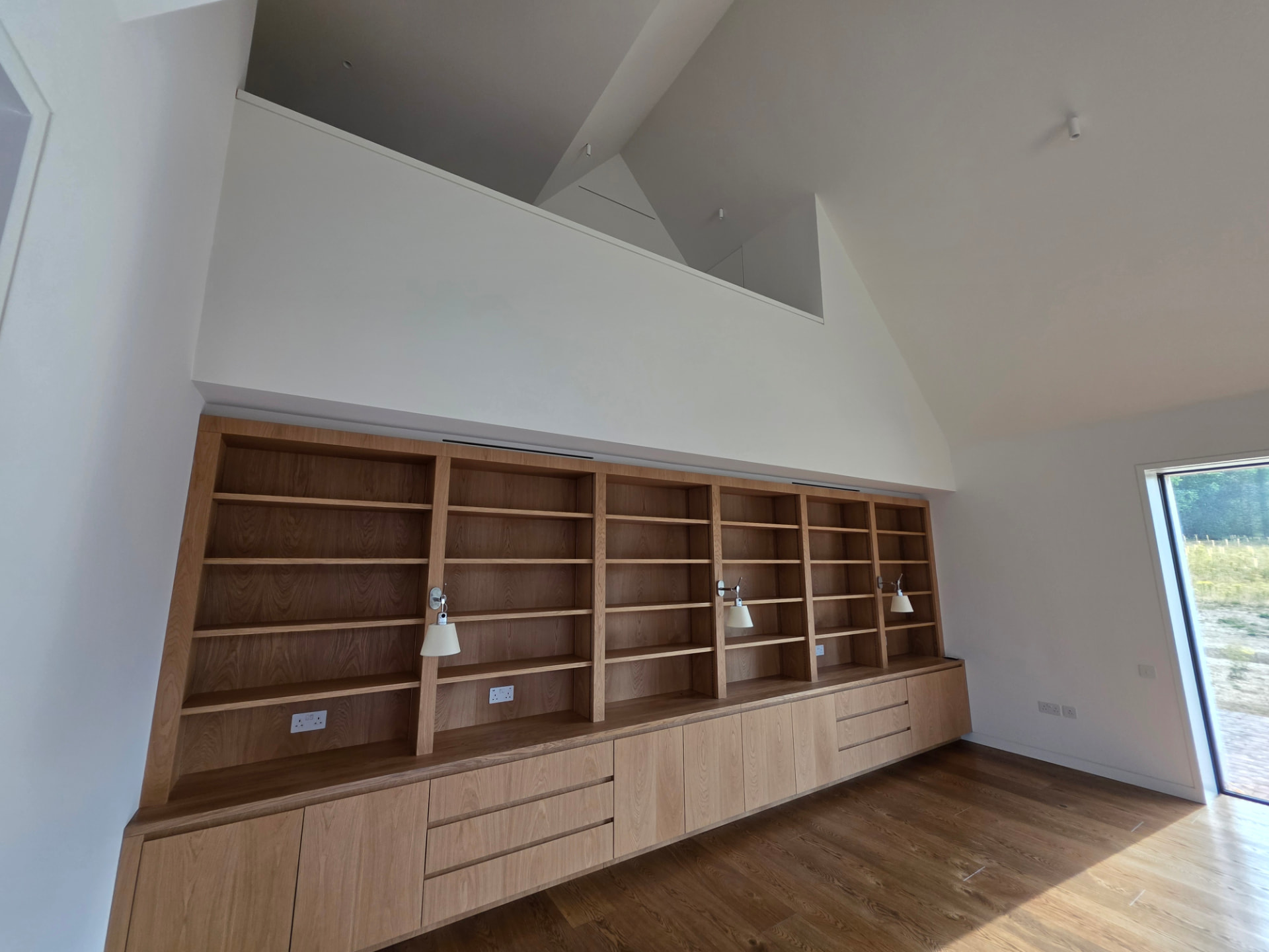 Bespoke oak joinery room with discreet ceiling ventilation slots