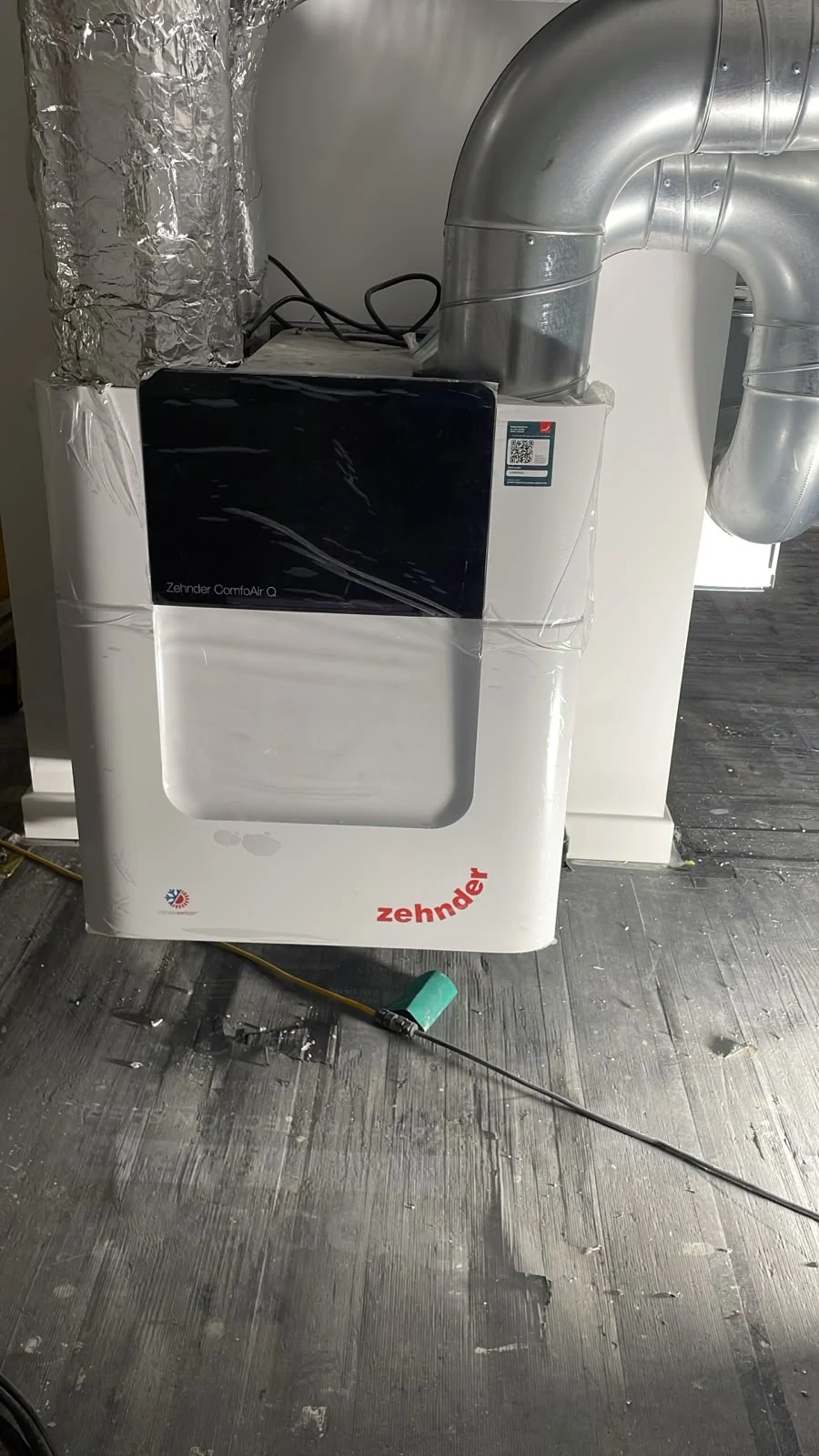 Zehnder ComfoAir Q MVHR unit installed with rigid metal ductwork